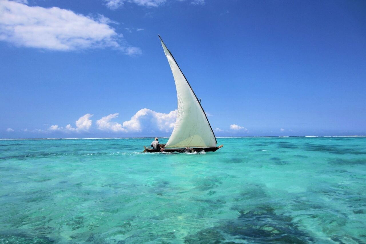 a boat on crystal clear waters in Zanzibar.